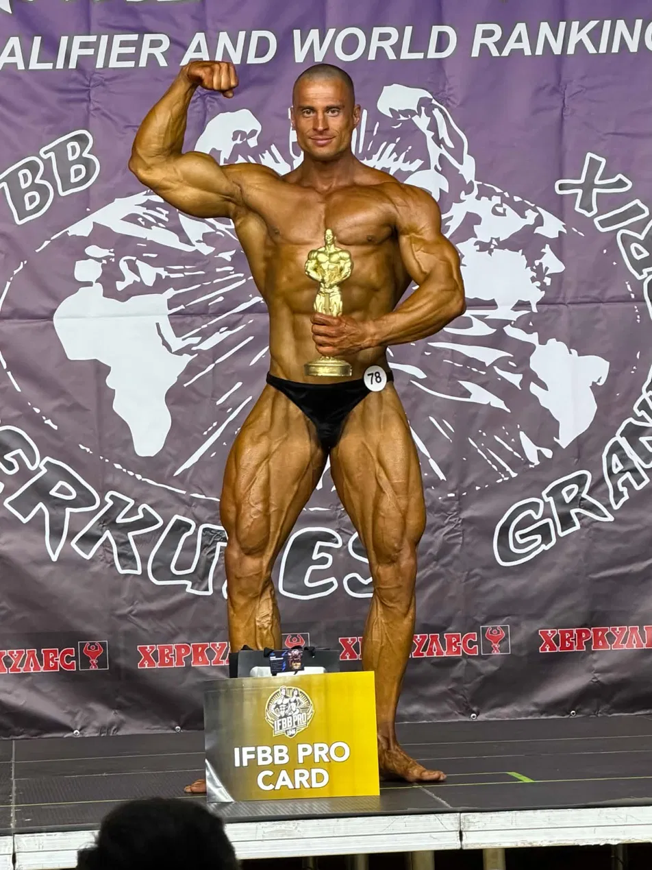 Stage pose with trophy